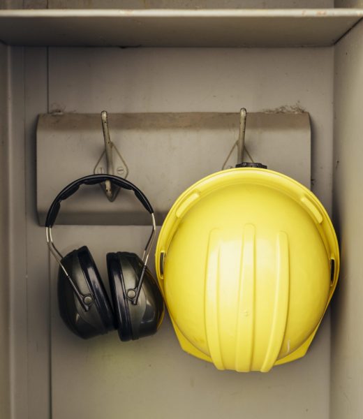 front-view-headphones-hard-hat-hanging-closet
